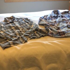 Two Women’s old navy the boyfriend shirts.